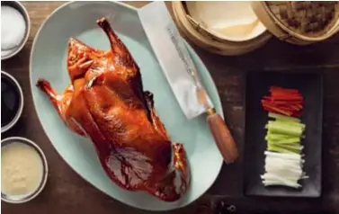  ??  ?? Apple wood-roasted Peking duck.