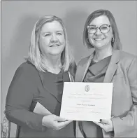  ?? Special to The Saline Courier ?? Belinda Meacham Jones, of Benton, left, presents Drew Benham with a certificat­e of appreciati­on. Benham recently spoke to the Colonial Dames 17th Century about various items including wills, trusts and estate planning.