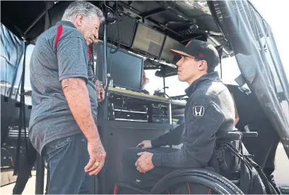  ?? DIRK SHADD TRIBUNE NEWS SERVICE ?? Robert Wickens, right, speaking to racing legend Mario Andretti, says a wheelchair is “a temporary transporta­tion system.”