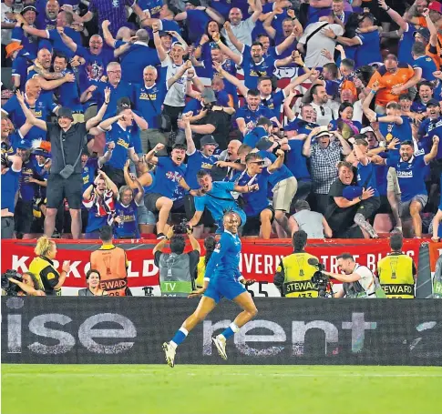  ?? ?? STORY OF THE BLUES: Rangers’ Joe Aribo celebrates scoring the opening goal during the Europa League Final in Seville last night, watched by Tory MSP Murdo Fraser, right, who has been criticised for the trip by SNP MP Pete Wishart.