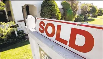  ?? Reed Saxon Associated Press ?? THE SURGES in home prices and sales in December are the latest signs that the Southern California housing market is gaining steam after a prolonged slowdown. The 22.1% rise in sales was the largest since late 2016.