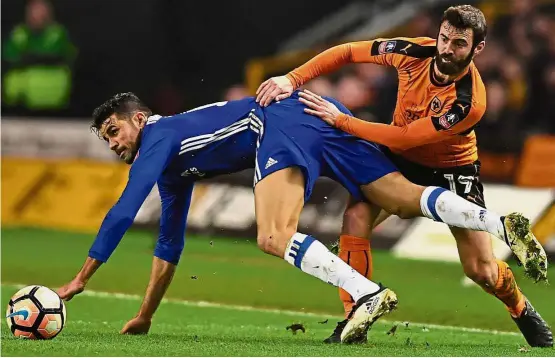  ??  ?? This isn’t rugby: Chelsea’s Diego Costa is fouled by Wolverhamp­ton Wanderers’ Jack Price in the English FA Cup fifth-round match on Feb 18. Below: England rugby coach Eddie Jones’ perfect record of 15 wins from 15 games since taking charge impresses...