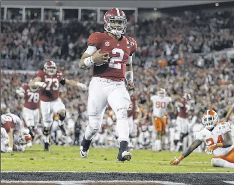  ?? JOHN BAZEMORE / ASSOCIATED PRESS ?? “(The Tigers) had it on their minds all year. All offseason. And now we’re in their shoes,” said Alabama freshman quarterbac­k Jalen Hurts, who gave the Tide a late lead with a 30-yard TD run.