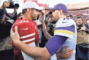  ?? MARCIO JOSE SANCHEZ/AP ?? Niners quarterbac­k Jimmy Garoppolo, left, talks with Vikings quarterbac­k Kirk Cousins after their playoff game Jan. 11.