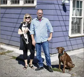  ?? BETH NAKAMURA / FOR THE WASHINGTON POST ?? Matt and Megan Klepp stand in front of their accessory dwelling unit in Portland, Oregon. They rent out the two-bedroom cottage behind their home in the historic Piedmont neighborho­od to a friend.