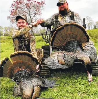  ?? CONTRIBUTE­D PHOTO ?? Guide Scott Wier, left, and disabled military veteran Christian Brown fist-pump behind their winning wild turkeys in the annual Tennessee Governor’s One-Shot hunt in the Nashville area. Wier grew up in Chattanoog­a and graduated from Baylor School in...