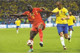  ?? Jewel Samad / AFP / Getty Images ?? Belgium’s Romelu Lukaku (left, against Brazil’s Miranda in the quarterfin­als) is one of several young players who is in his prime ahead of the 2020 European championsh­ips.