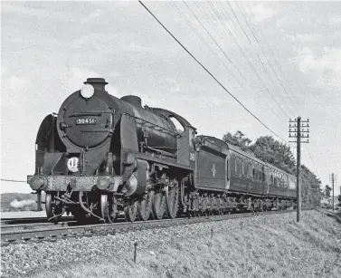  ?? D M C Hepburne-Scott/Rail Archive Stephenson ?? In its twilight years, No 30451 Sir Lamorak heads the three-coach 1.30pm London (Waterloo) to Salisbury train near Oakley, between Worting Junction and Overton on Saturday, 16 September 1961 – Oakley station is seen in the distance, the stop being booked at 2.57pm. At this time duty 465 was No 30451’s regular turn and the consist could vary from a Bulleid three-coach set, as seen here, to five or six coaches plus parcel vans as traffic demanded. Being the last of the class to receive a heavy overhaul, Sir Lamorak was to see out its working life on this working and on seasonal parcels trains. It seems not to have been relegated to goods workings and empty stock trains.