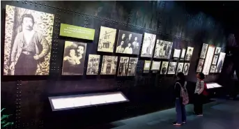  ??  ?? File photos of Lu Xun are on display at the Memorial Hall of Lu Xun. The renowned writer spent his last decade in Hongkou District. — Jiang Xiaowei