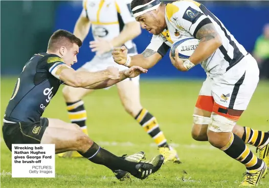  ?? PICTURES: Getty Images ?? Wrecking ball: Nathan Hughes gives George Ford the brush-off