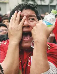  ?? Reuters ?? A Peru fan in Lima reacts after France went ahead against the South Americans in a Group C match.