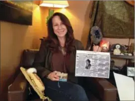  ?? JOHN ROGERS — THE ASSOCIATED PRESS ?? In this photo, Betsy Roddy of Los Angeles holds a copy of the edition of The River Press of Fort Benton, Mont. The newspaper was one of the first to report on Father’s Day, an event held for the first time in June of that year in Spokane, Wash., after...