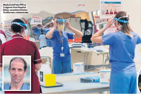  ?? NIALL CARSON/PA WIRE ?? Medical staff don PPE at Craigavon Area Hospital. Below, consultant Damien Scullion