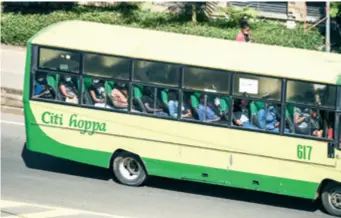  ??  ?? Passengers wear masks in a bus in Nairobi, Kenya, on June 4