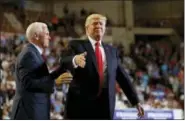  ?? CAROLYN KASTER — THE ASSOCIATED PRESS ?? President Donald Trump is greeted by Vice President Mike Pence as he arrives to speak at the Pennsylvan­ia Farm Show Complex and Expo Center in Harrisburg, Pa., Saturday, April, 29, 2017.