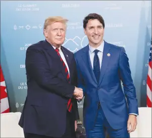  ?? CP PHOTO ?? Prime Minister Justin Trudeau meets with President Donald Trump at the G7 leaders summit in La Malbaie, Que.