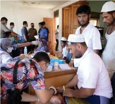  ?? — AFP photo ?? File photo shows newly arrived Rohingya refugees receiving medical treatment at their shelter in Meulaboh, West Aceh.