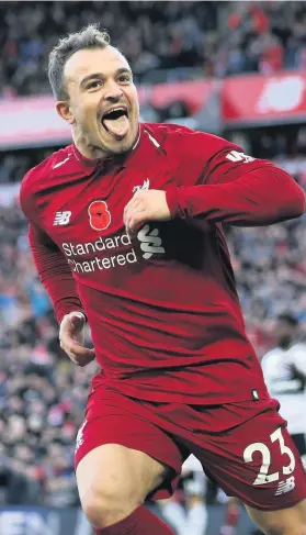  ?? Picture: Barrington Coombs/PA ?? Xherdan Shaqiri shows his delight at scoring Liverpool’s second goal in the win against Fulham at Anfield