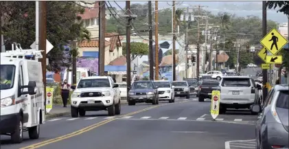  ?? The Maui News / MATTHEW THAYER photo ?? Traffic passes through Wailuku town in January. A proposed Maui County Council bill would tighten many laws for nearly 70 acres of downtown Wailuku in response to litigation against the county.