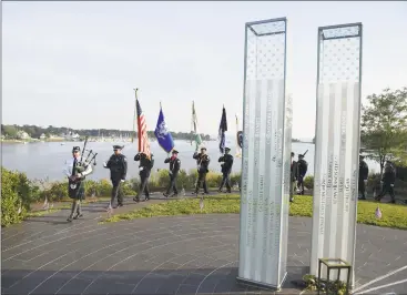  ?? Tyler Sizemore / Hearst Connecticu­t Media ?? An honor guard leads a procession during the Sept. 11 Remembranc­e Service at Cos Cob Park Wednesday. More than 200 people attended the ceremony on the 18year anniversar­y of the 9/11 attacks on the World Trade Center.