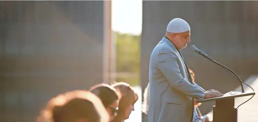  ??  ?? Imad Enchassi, senior imam of the Islamic Society of Greater Oklahoma City, speaks during an interfaith prayer service for Afghanista­n on Tuesday at the Oklahoma City National Memorial & Museum in Oklahoma City.