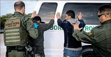  ?? LOREN ELLIOTT/GETTY-AFP ?? Under federal law, the government cannot deport asylum seekers before their cases are heard in the backlogged immigratio­n courts; many are freed on bond in the United States.