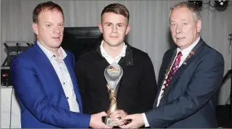  ??  ?? Brendan Lacken and Cathaoirle­ach of Sligo County Council, Cllr. Seamus Kilgannon presenting Regan Donelon with the Young Player of the Year Award at the Sligo Rovers Gala Awards.