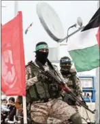  ?? SAID KHATIB/AFP ?? Members of the Ezzedine al-Qassam Brigades attend a memorial in Gaza in January.