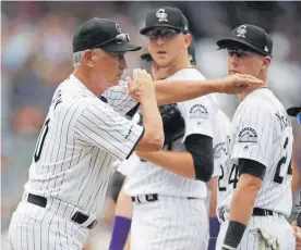  ??  ?? Rockies manager Bud Black, front, says the new three-batter rule could have all sorts of unintended consequenc­es for coaches managing their bullpen.