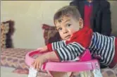  ?? AFP ?? Donald Trump, the Afghan boy aged around 18 months, plays at his home in Kabul.