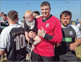  ??  ?? Mason Turner with his uncle and Newtown goalkeeper Ken Turner.