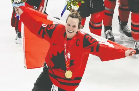  ?? GAVIN YOUNG ?? Canada captain Marie-philip Poulin celebrates the hockey team's gold medal at the Winter Games in Beijing last February. This year's Northern Star Award recipient as Canada's top athlete is a convenient sentimenta­l selection, writes Steve Simmons, but perhaps not the best choice.