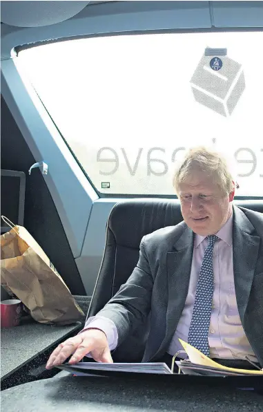  ??  ?? Boris Johnson aboard the Vote Leave battle bus as he campaigned in Cornwall