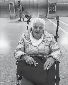  ?? SUBMITTED PHOTO ?? Lucy Chiasson, 87, of New Waterford, is shown at the Toronto Airport on Jan. 6 waiting to board an Air Canada flight returning home after visiting family. Family members publicly expressed concern after Chiasson was carried off the plane at the Sydney airport in a Washington chair but say they are happy that Air Canada has committed to getting a ramp.