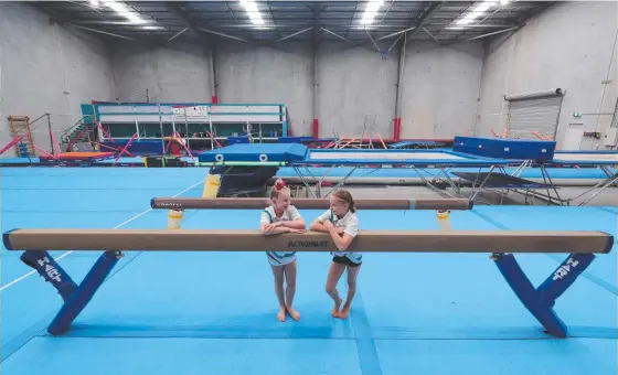  ?? Picture: GLENN HAMPSON ?? Olive Davis, 9, and Lyla Proctor, 10, are eagerly awaiting the Varsity Lakes Trampoline and Gymnastics Club getting back into full swing.