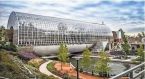  ?? PAUL CLARK PHOTO ?? Centerpiec­e of the Myriad Botanical Gardens in Oklahoma City is the Crystal Bridge Conservato­ry and its tropical and desert plant collection­s, waterfall and sky bridge.