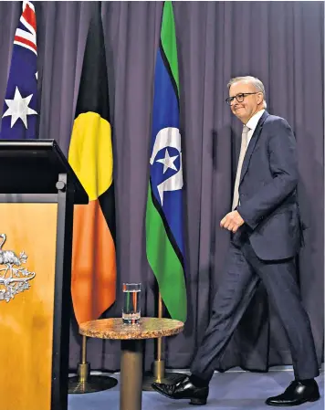  ?? ?? Anthony Albanese with the Aboriginal flag, centre, and Torres Strait Islander flag, right, at Parliament House in Canberra