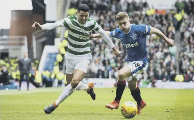  ?? PICTURE: ALAN HARVEY/SNS ?? 0 Greg Docherty tracks Tom Rogic’s run during Sunday’s Old Firm derby, the result of which left the young Rangers midfielder in despair.