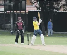  ??  ?? Whitburn batsman Lee Henderson goes on the attack.