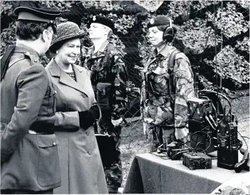  ??  ?? ■
Queen Elizabeth II meets Signal Corps on her June 1977 Silver Jubilee tour of Wales. ales.