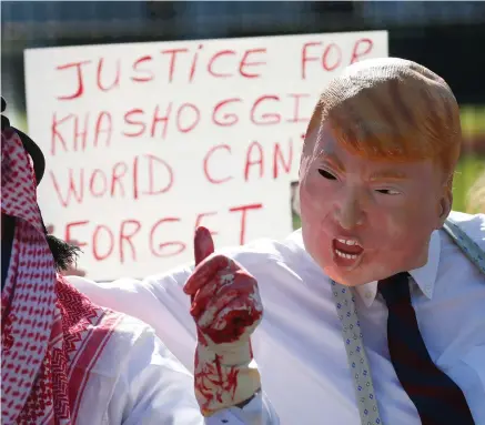  ??  ?? Anger: Protesters dressed as Donald Trump and Saudi Prince Mohammad bin Salman in Washington yesterday