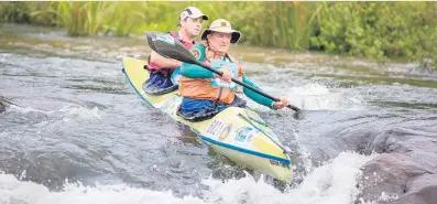  ?? Picture: PdGPix.com/Gameplan Media ?? MAGNIFICEN­T ACHIEVEMEN­T. Lyle Wheeler and his son Billy negotiate Taxi Rapid on the uMsundusi River. Lyle set a new record for the most number of Dusi finishes this year, passing the mark set by the legendary Graeme Pope-Ellis.