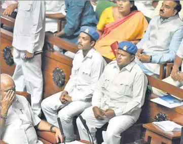  ?? ARIJIT SEN/HT PHOTO ?? Karnataka’s chief minister for two days, BS Yeddyurapp­a (left) before his speech at Vidhan Soudha during a special session to prove majority in the assembly by the Bharatiya Janata Party, in Bengaluru on Saturday.