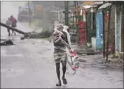  ?? Associated Press ?? CYCLONE AMPHAN’S rain and winds sent nearly 150,000 in India’s Odisha state f leeing for shelter.