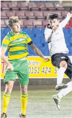  ?? John Rooney ?? George Lomax (right) beats Adam Jones to a header during Monday’s clash.