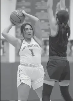  ?? ?? Jenika Fuentes (1) and Tate Thompson (2) are closely defended as they look to pass the basketball in recent high school action.