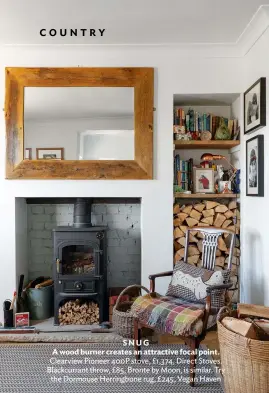  ??  ?? SNUG
A wood burner creates an attractive focal point. Clearview Pioneer 400P stove, £1,374, Direct Stoves. Blackcurra­nt throw, £85, Bronte by Moon, is similar. Try the Dormouse Herringbon­e rug, £245, Vegan Haven