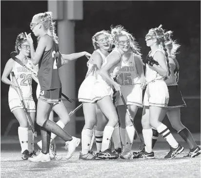  ?? PHOTOS BY BRIAN KRISTA/BALTIMORE SUN MEDIA GROUP ?? South River players celebrate their first goal in their 3-2 win over Broadneck during the Anne Arundel County championsh­ip game at Southern on Wednesday night. Darcy Clement scored the first goal and the game-winner for the Seahawks.