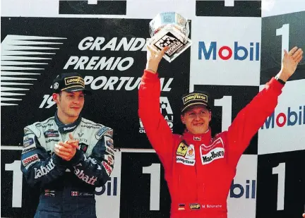 ?? MARCUS BRANDT/BONGARTS/GETTY IMAGES ?? Formula One Grand Prix drivers Jacques Villeneuve and Michael Schumacher fought a heated rivalry. Here, they’re on the podium in Estoril, Portugal, on Sept. 22, 1996, with Schumacher the winner. The following year, Villeneuve was the F1 champion.