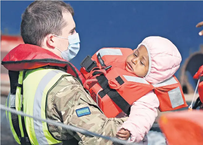  ?? ?? Migrants arrive at Dover Port after being picked up by Border Force yesterday. The total who have been brought ashore this year numbers more than 6,000